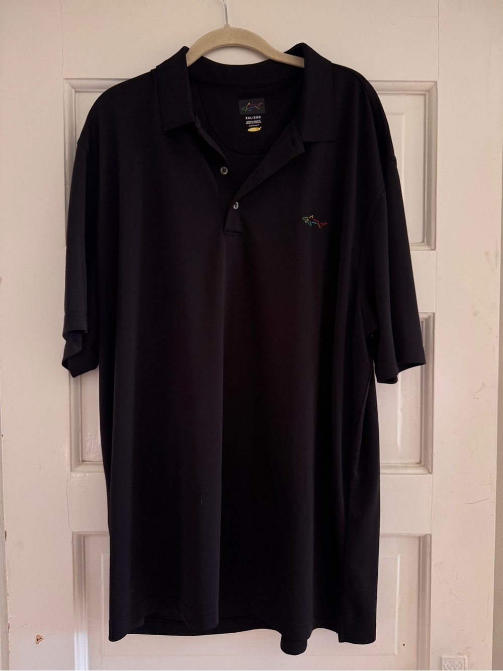 Greg Norman Collection Black Polo with Subtle Multicolor Shark Logo Golf Shirt